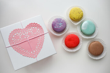 romantic composition for valentine's day. red heart, gift box and chocolates 