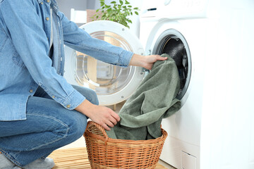 Concept of housework with washing machine and girl on white background - obrazy, fototapety, plakaty