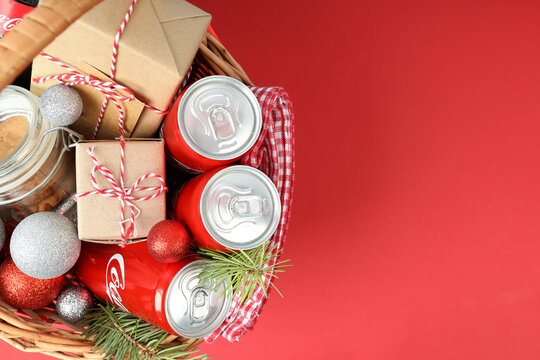 Odessa, Ukraine - November 10, 2021: Concept of gift with Christmas basket, red background