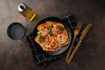 Delicious food concept with ravioli on textured background