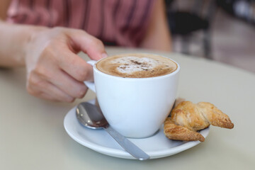 Fresh breakfast with hot coffee and mini croissant 