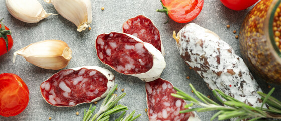 Сoncept of tasty food with salami sausage, close up
