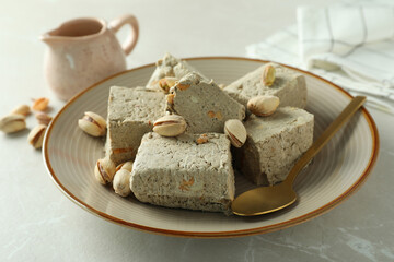 Concept of tasty food with halva on light background