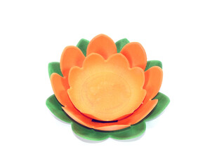 Krathong in lotus flower-shape for Loy Krathong festival. Biodegradable Krathong made from tapioca starch. Krathong isolated on white background