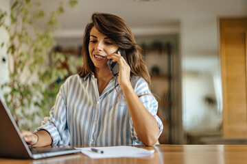 Satisfied caucasian woman, receiving a phone call