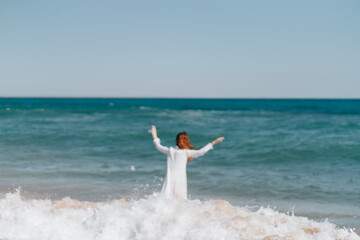 Woman in white dress near the ocean walk fresh air landscape
