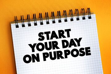 Start Your Day On Purpose text on notepad, concept background.