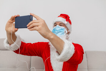 dressed as Santa Claus talking via video conference