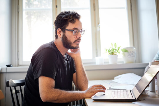 Young man using laptop