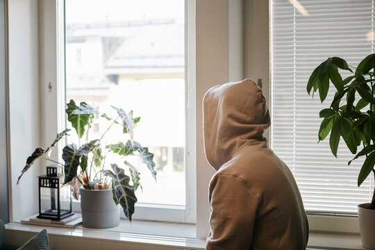 Person wearing hoodie looking away