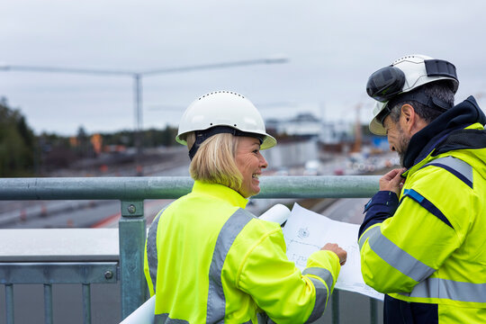People talking on building site