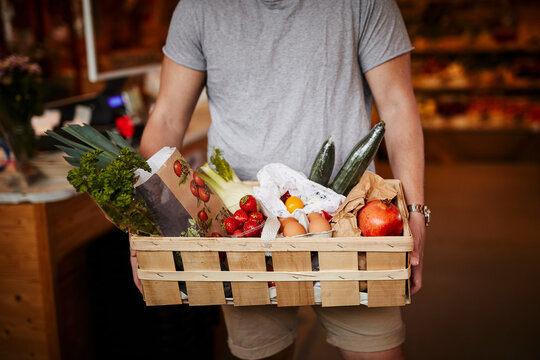 Man doing shopping in shop with organic food
