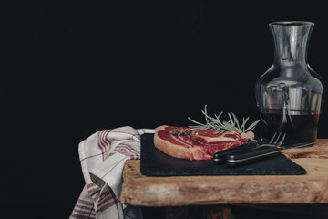Raw fresh marbled meat Steak and seasonings on dark marble background.