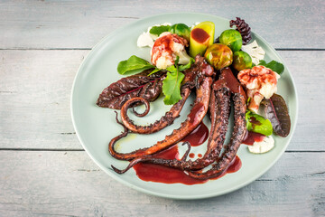 Humboldt squid with beetroot sauce and blanched vegetables