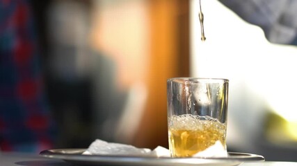 Enjoying the local custom of mint tea at a cafe in the Medina section of Marrakech, Morocco.