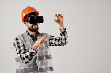 male worker in virtual reality glasses innovation light background