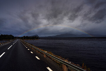 Full rainbow against dramatic sky