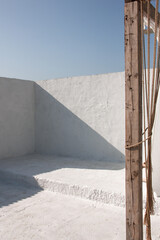 white stone wall with nobody on blue sky background at sunny day in greece. travel concept, free space
