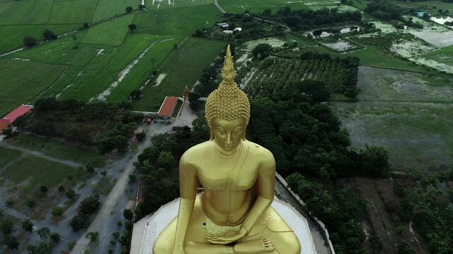 Thailand, the tall golden Buddha image from a drone	