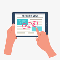 Hands holding tablet and reading fake breaking news. Propaganda, disinformation and hoax concept.