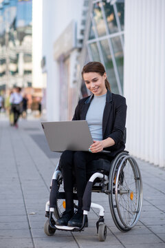 Disabled businesswoman in a wheelchair working outside
