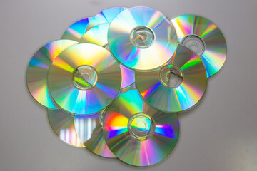 Lots of CDs DVDs on a gray background.