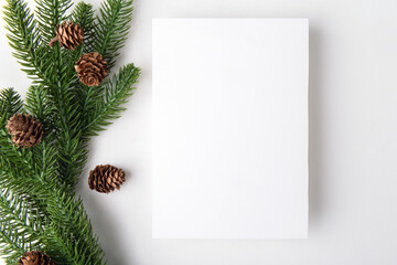 Christmas 5x7 card mockup template with fir twigs on white background. Design element for Christmas...