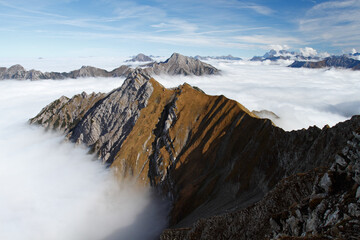 mountains out of high fog