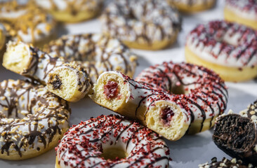 donuts with different flavors, fillings and different sprinkles