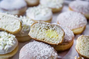 donuts with different flavors, fillings and different sprinkles