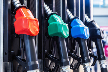 Petrol pump filling nozzles at gasoline gas station