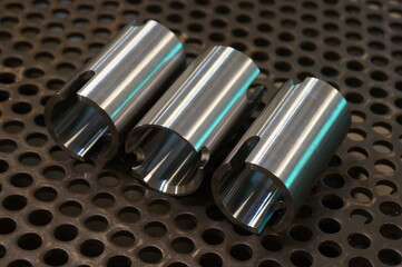 Close-up of Shiny circular precision steel industrial machine parts.
