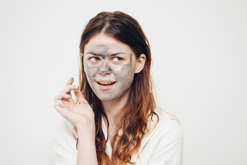 redhead woman facial mask skin care rejuvenation