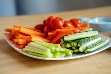 Plate with sliced vegetables, vegetarian snacks