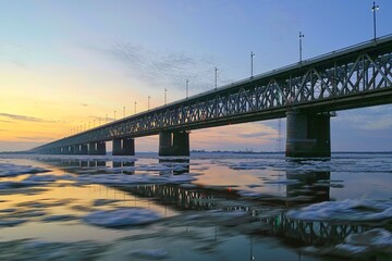 Ice drift on the Amur river. Motion blur. Amur bridge, Trans Siberian railway. Khabarovsk, far East, Russia.