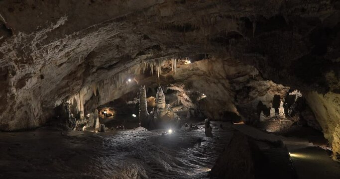 Beautiful shots of karst cave, Lipa Cave situated Serbia, East Europe. Illuminated dark cave with stalactites and stalagmites. Unique nature landscape. High quality 4k footage