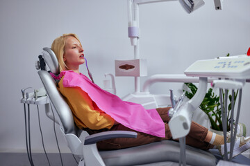 Female patient lying on dental chair