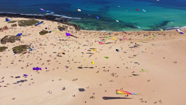 kite fest fuerteventura, Spain , festival de cometas , kite in turquoise water and white beach in canary island, drone 4K footage