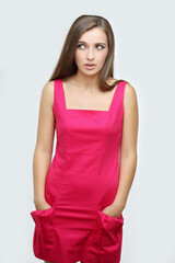 Portrait of confused young woman complaining