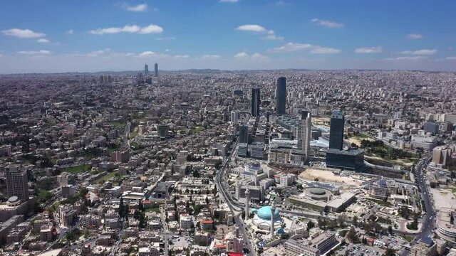 Top view of Amman Jordan city. Aerial Drone fly over futuristic Abdali area district on beautiful day. Residential Modern skyscraper buildings