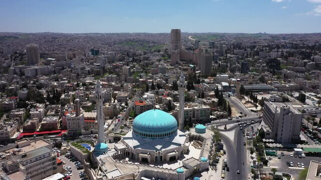 The dome of an Islamic mosque in Amman, Jordan. King Abdullah I Blue Mosque. Drone top shot
