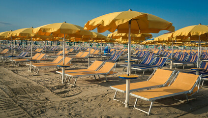 Sun loungers and umbrellas are waiting for vacationers © Glass Bear