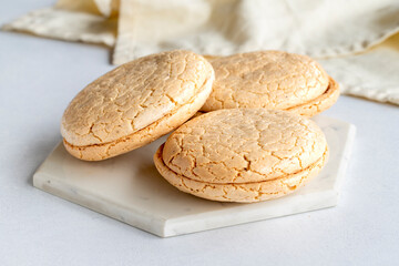 Acıbadem macaroon on a white background. Traditional Turkish cuisine flavor. delicious cookies. Local name acıbadem kurabiyesi