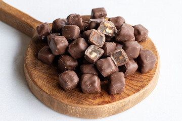 Chocolate covered Turkish delight on a white background. Traditional Turkish cuisine flavor.
