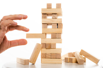 cropped view of man playing blocks wood tower game isolated on white