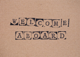 Cardboard with words Welcome Aboard