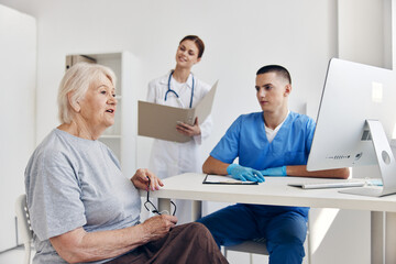 elderly woman at the doctor's and nurse's appointments checkup