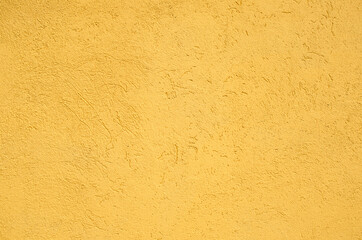 Texture of the yellow stucco wall	