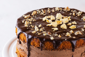 American pumpkin pie with orange and nuts on a light background. Sugar, gluten, lactose free, vegan.