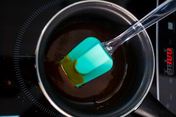  Pastry maker making chocolate for making the cake.
